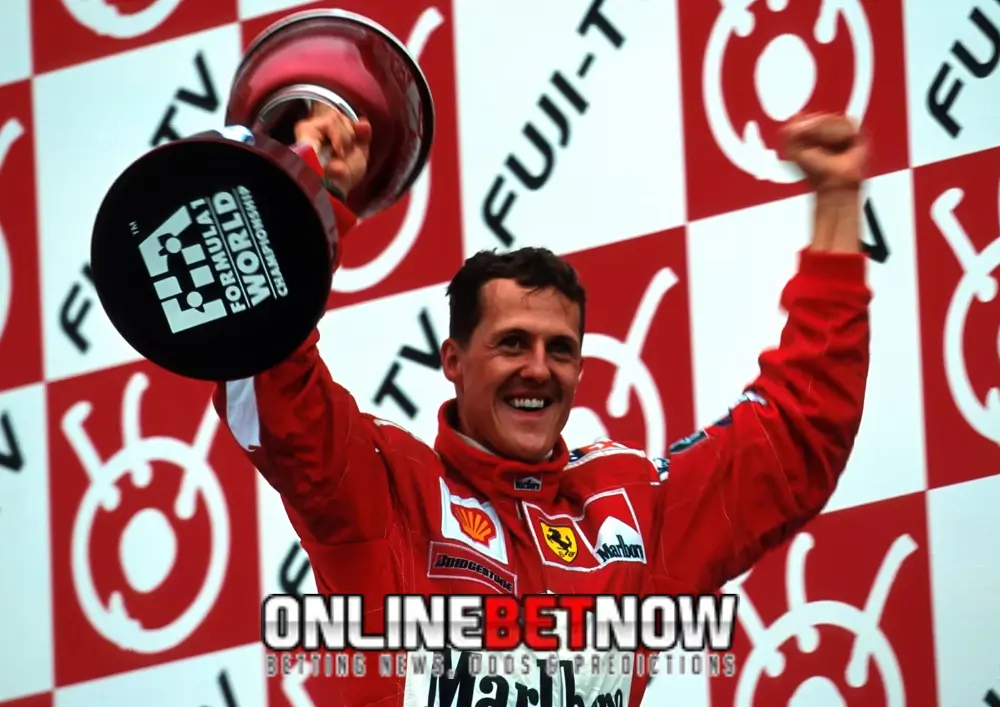 Micheal-Schumacher raising the trophy after winning the race