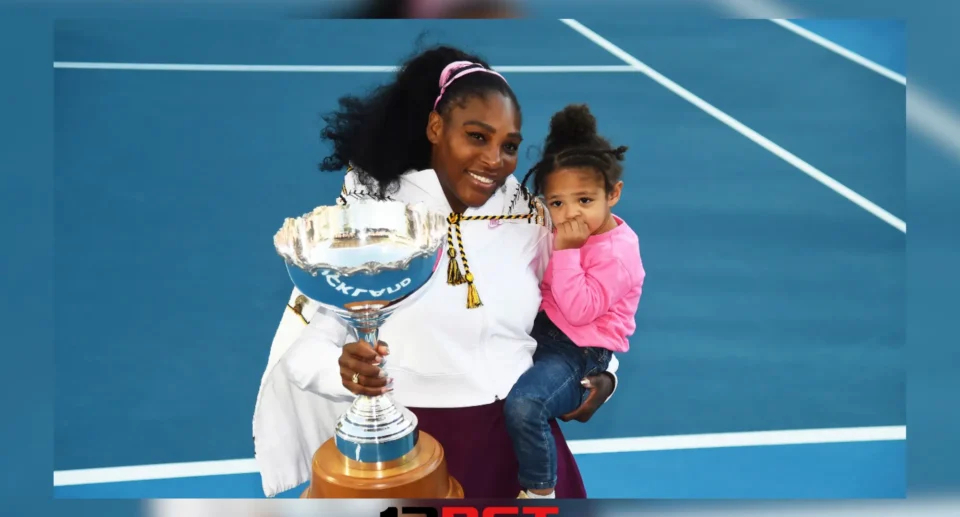 Serena William Holding Throphy and her daughter Alexis Olympia Ohanian Jr